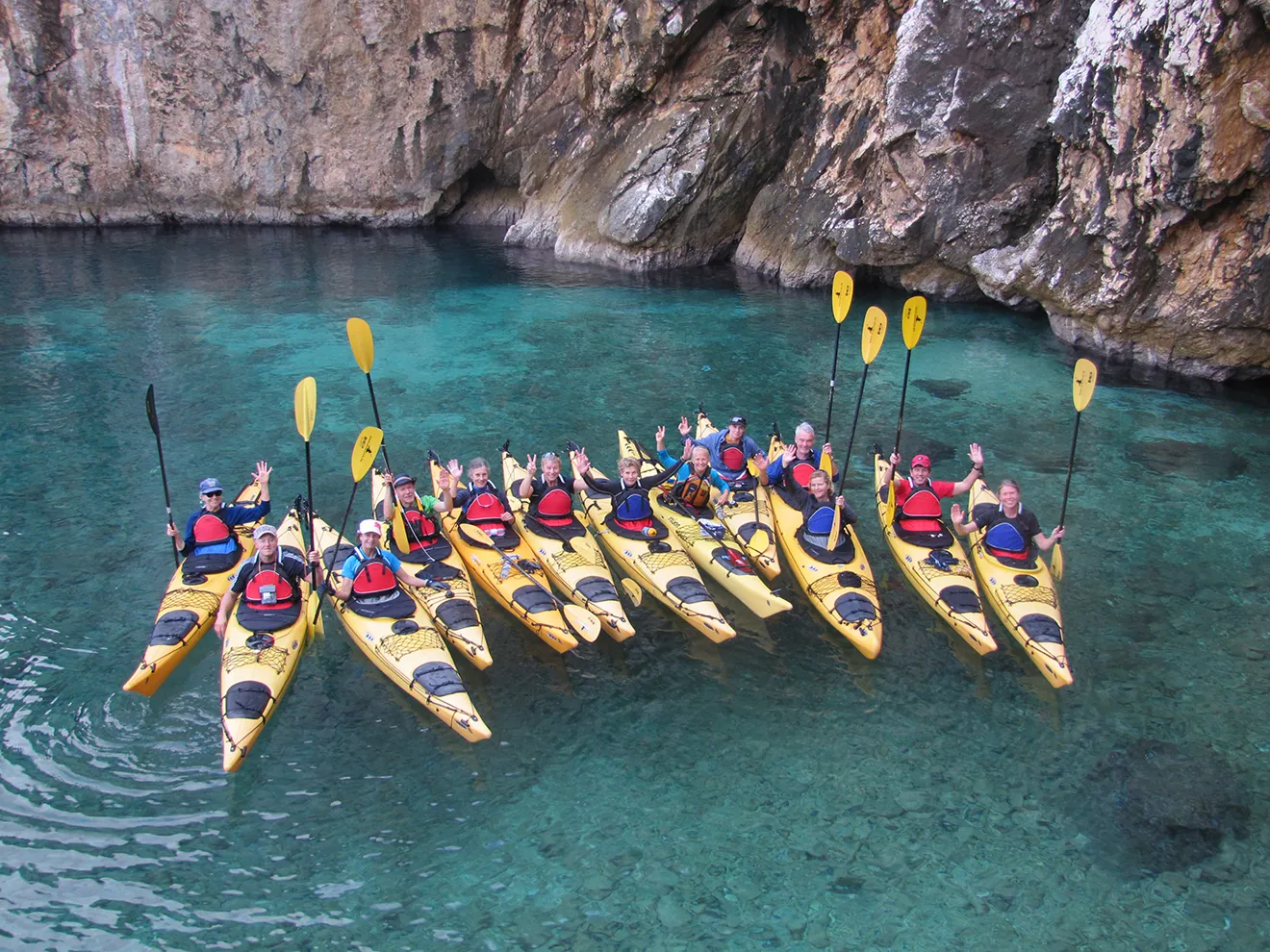 group of person with sea kayak