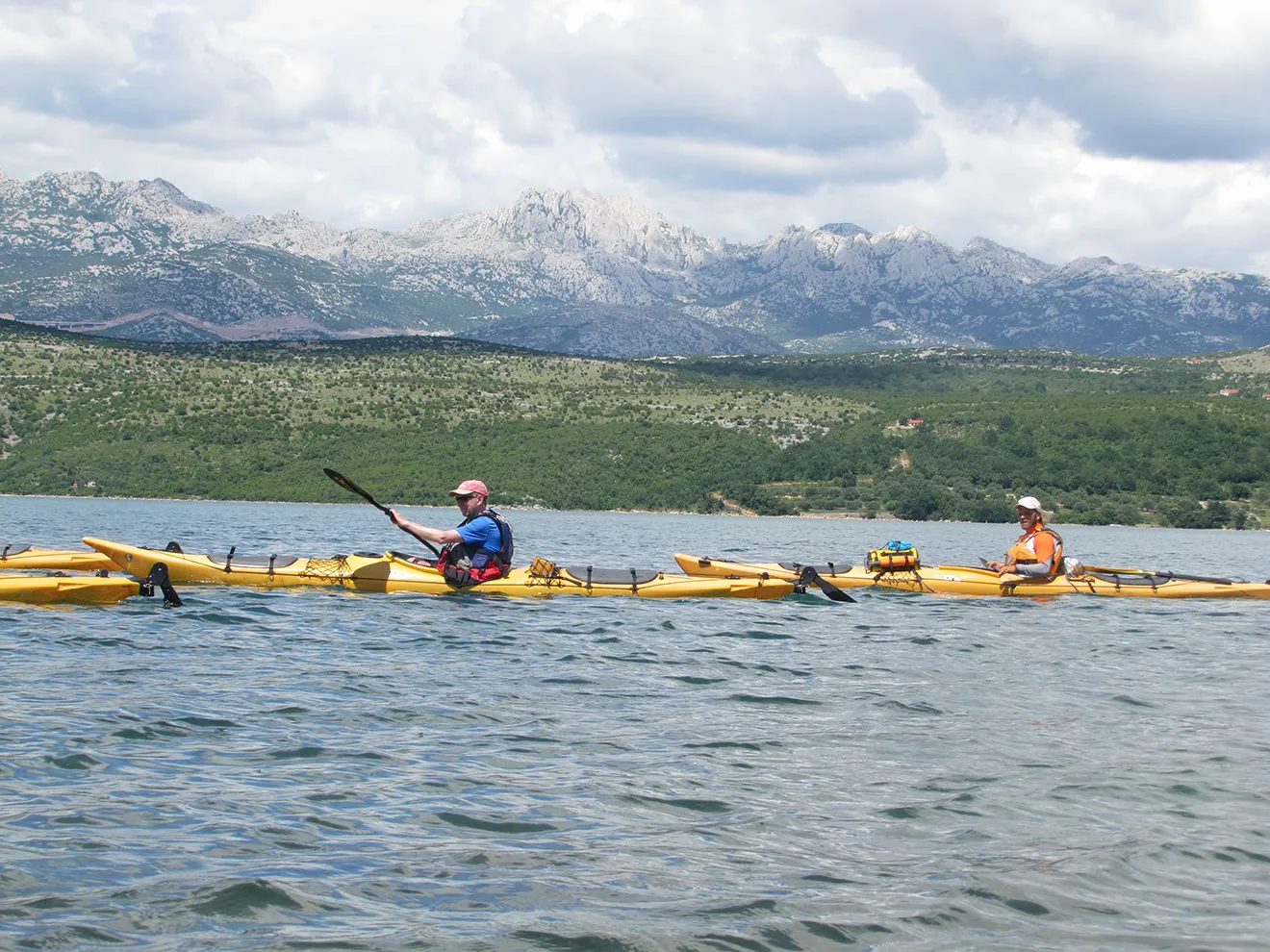 group of person with sea kayak